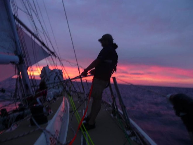 Rob Collins trimming at sunset on Spirit of Australia - Clipper 09-10 Round the World Yacht Race © Clipper Ventures PLC . http://www.clipperroundtheworld.com